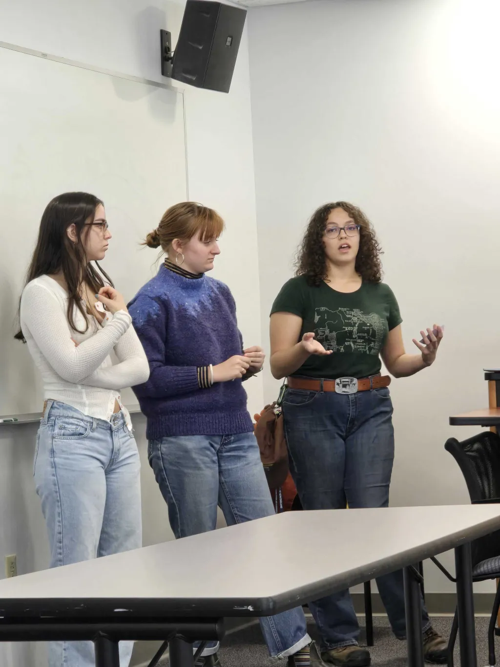 Ava Richardson (right) and Piper Stagg (middle) presenting their OBI presentation with a third classmate.