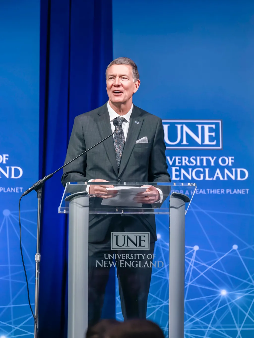 UNE President James Herbert speaks at the podium
