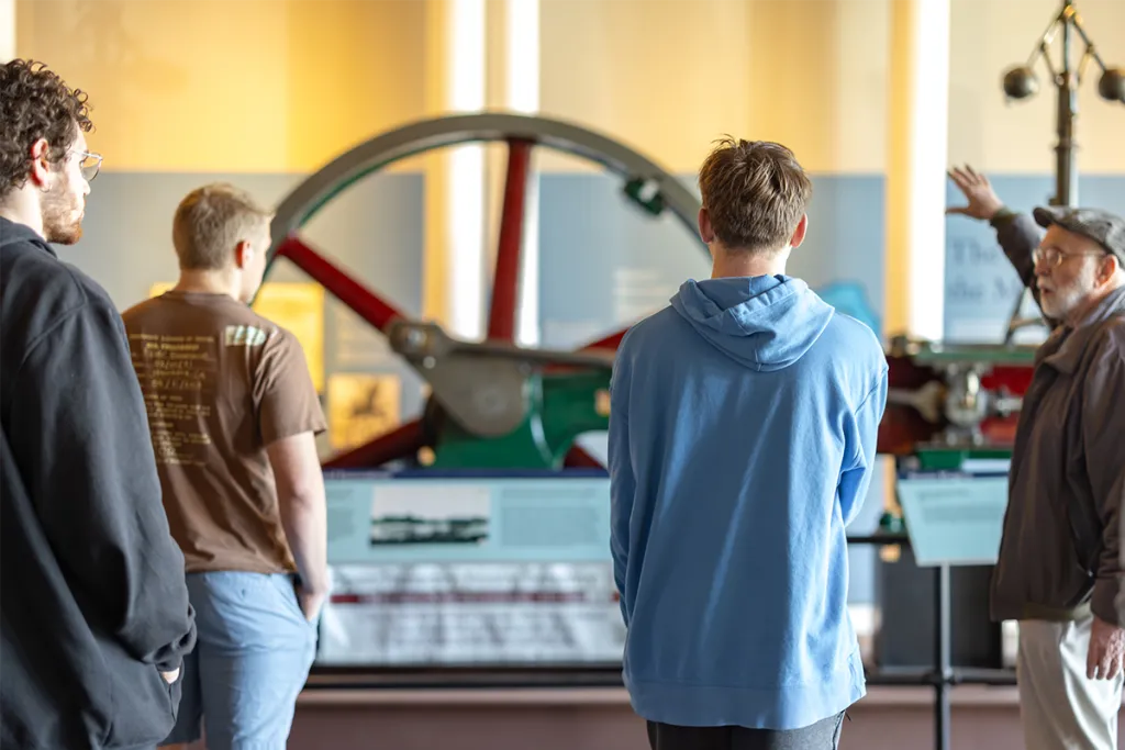 A group of Public History students on a tour of an old textile mill