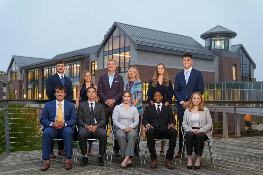 A group photo of the Presidential Ambassadors alongside President Herbert and his wife, Lynn