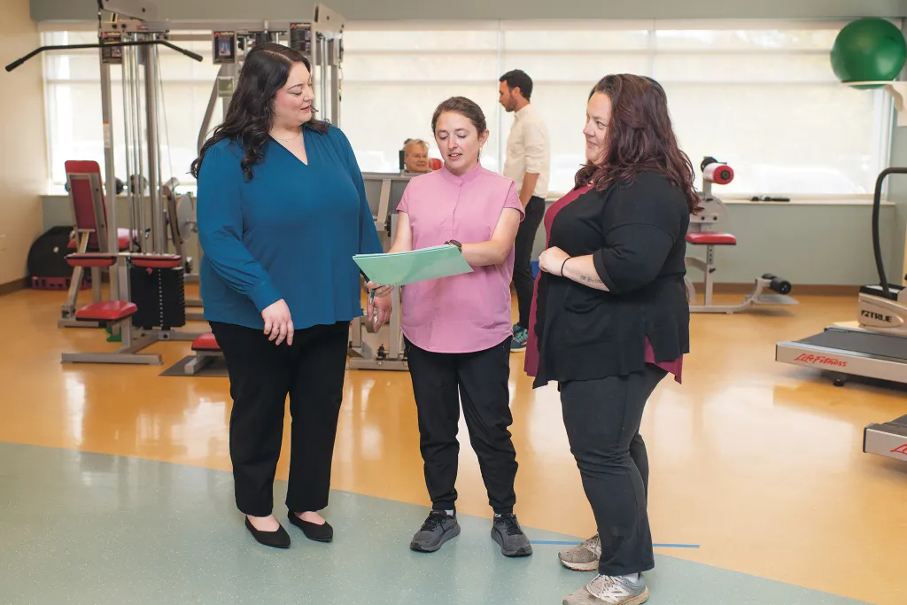 Olivia Franceschelli collaborates with colleagues in the functional restoration program at Dartmouth Hitchcock Medical Center to review a patient's treatment plan.