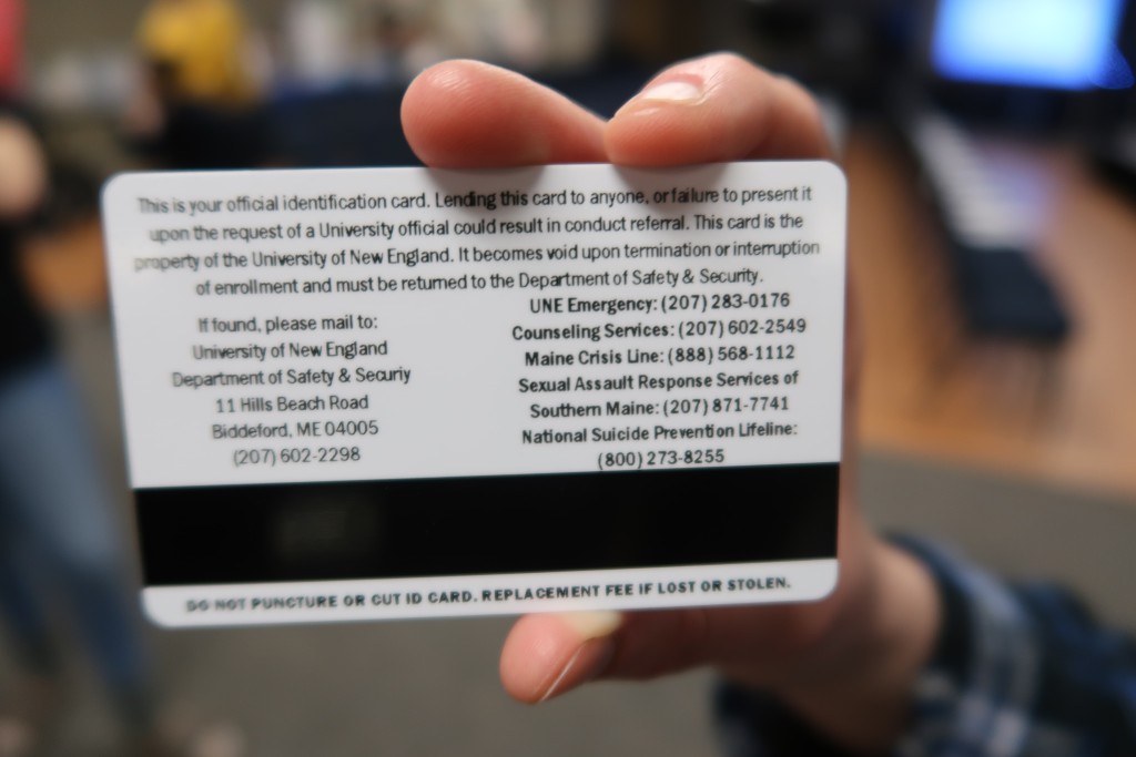 UNE identification cards now include hotline numbers printed on the back