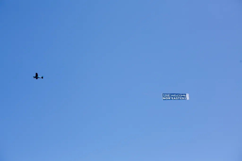 A plane flew overhead welcoming new students as they moved in.