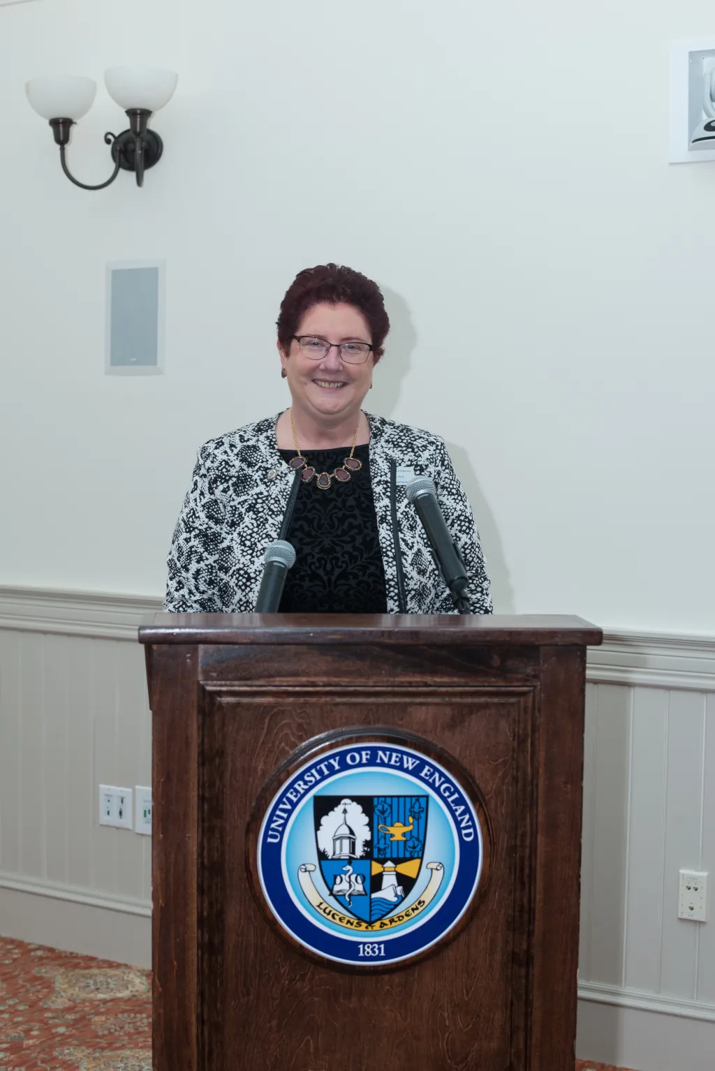 Dean Brazeau presents at the Rho Chi Honor Society induction ceremony.