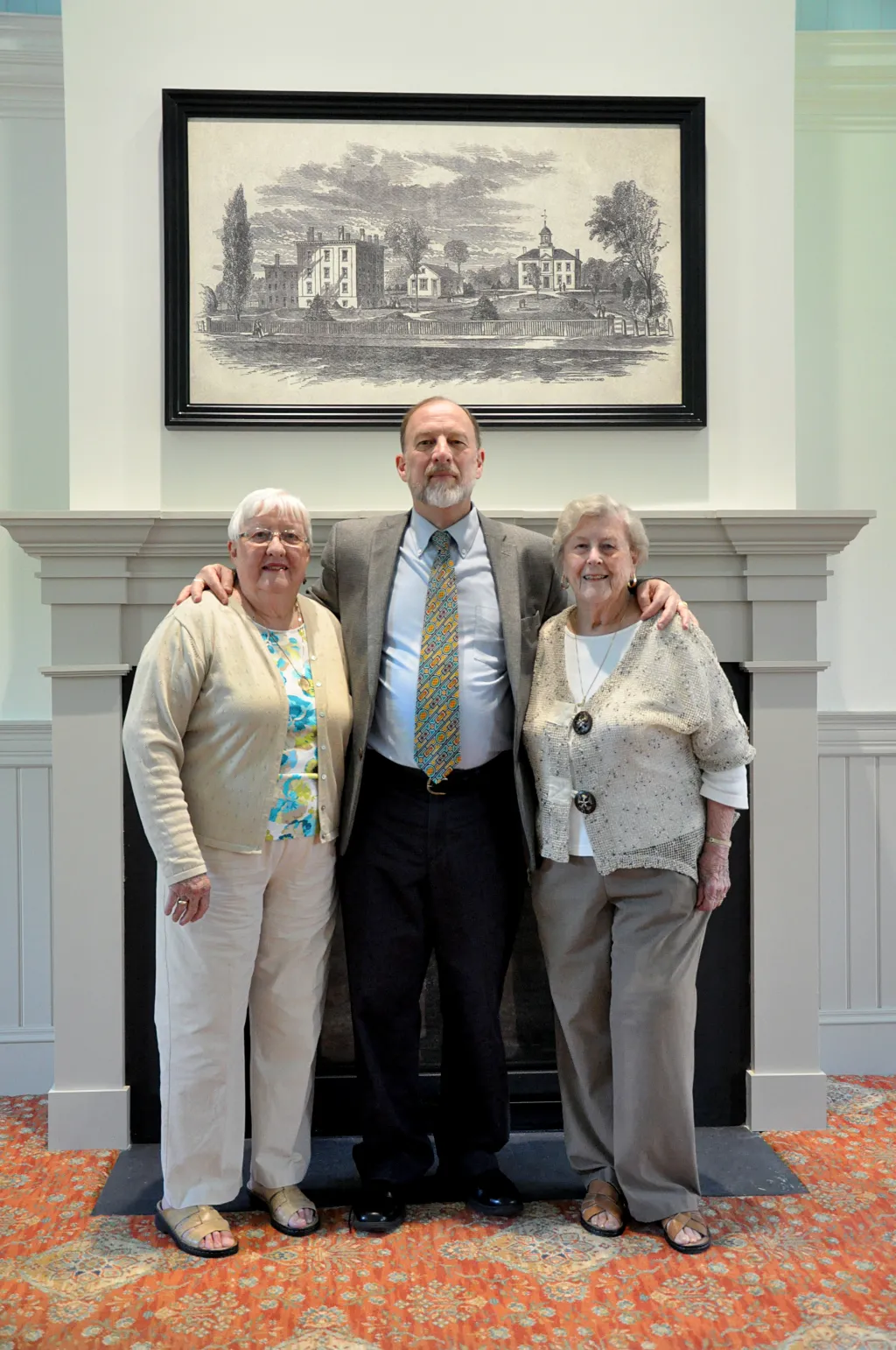 Judith Keegan Sturgeon, Jo Anne Vaughan Thomas Hall, and William Chance inside Alumni Hall