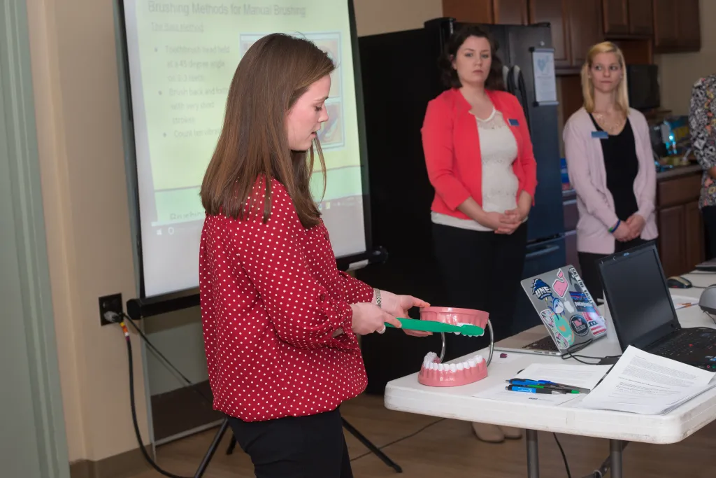 Carolyn Dacey demonstrates the proper brushing technique