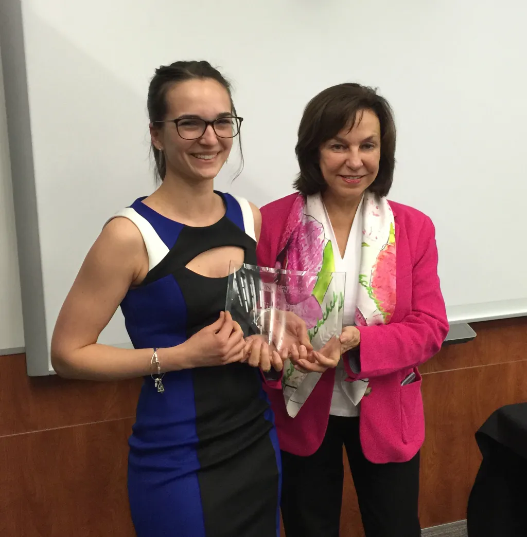 Kaitlyn Schoen, who took first prize, is congratulated by President Ripich.