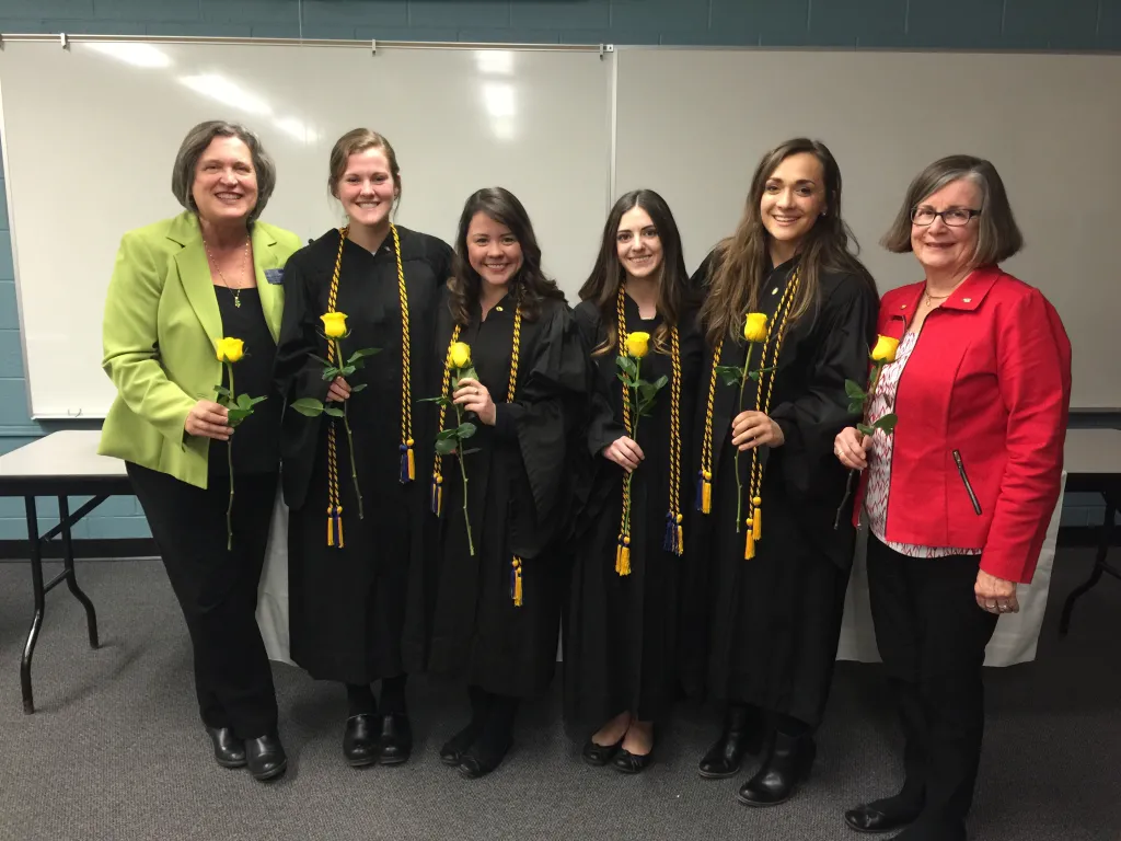 Pi Theta officers with advisors Kate Loukas and Nancy MacRae