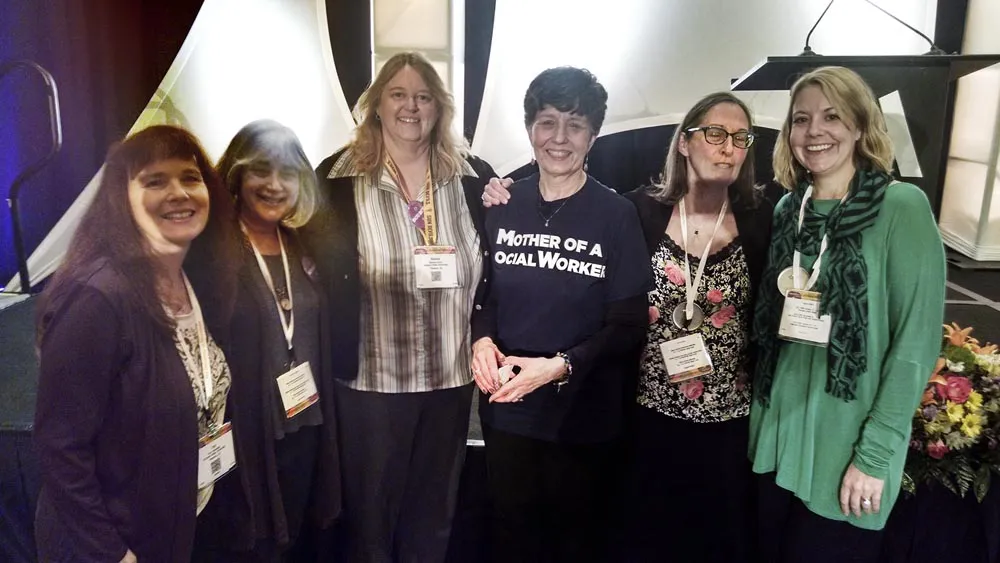 Shelley Cohen Konrad poses for a group photo with Barbara Brandt (center)