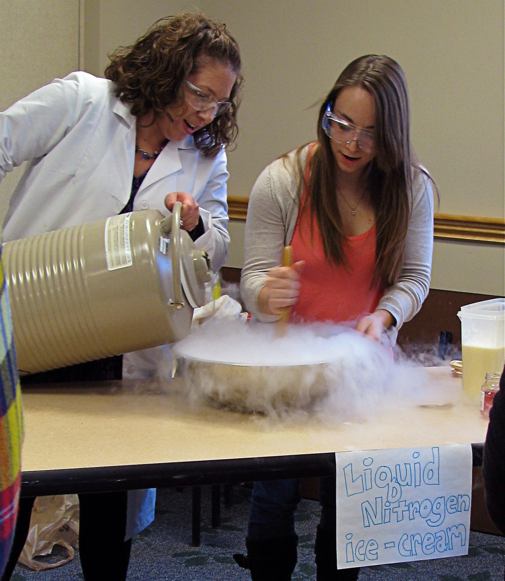 Amy Keirstead and Natalie Sroda, B.S. ’13 (Biochemistry) make liquid nitrogen ice cream during the Chemistry Club's National Che