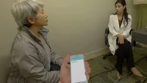 Clay's wife talks with the doctor while Clay communicates via texting. Photo: Embodied Labs