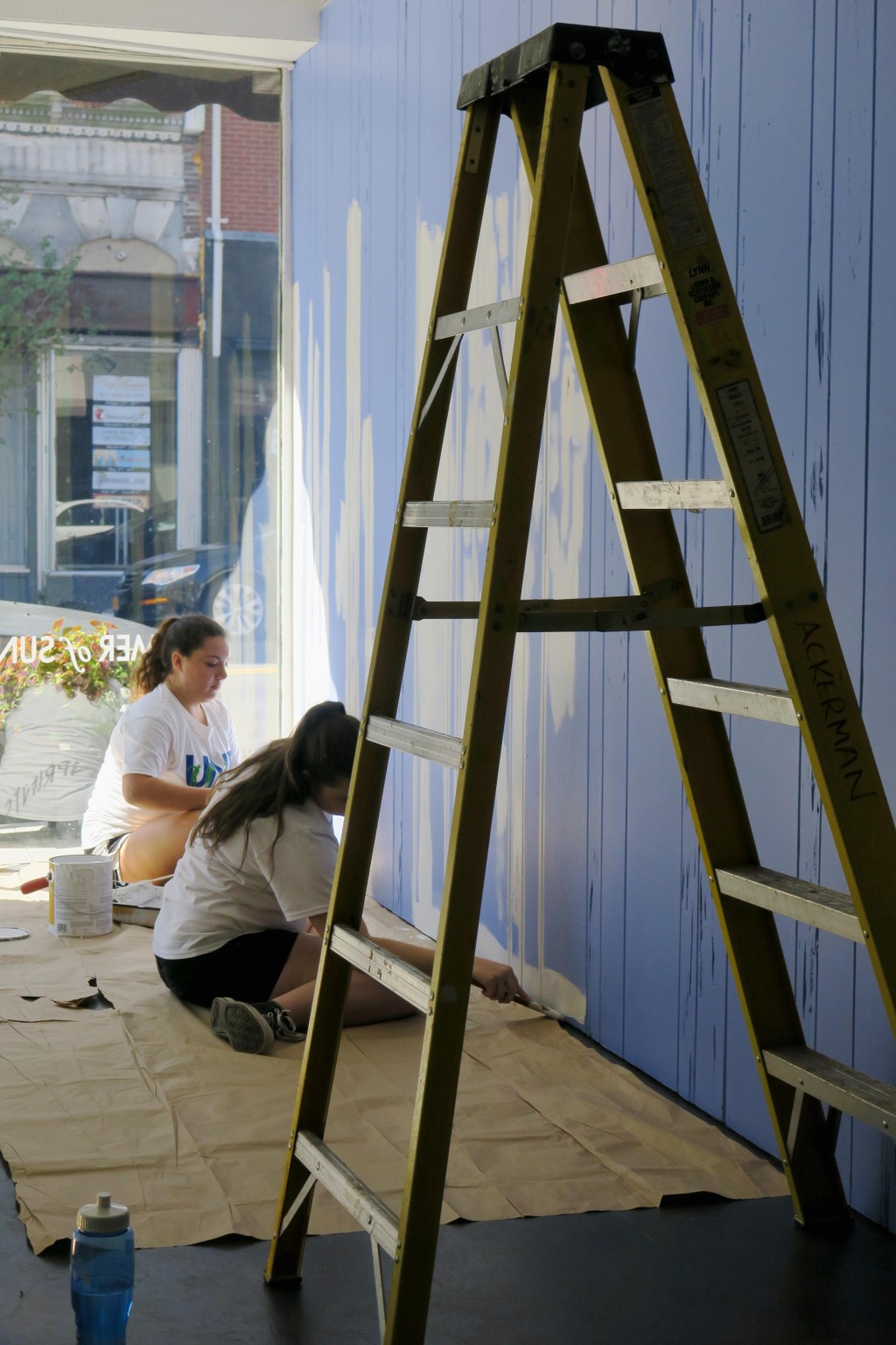 UNE students get some painting done at Engine, a community-based arts hub on Main Street in Biddeford.