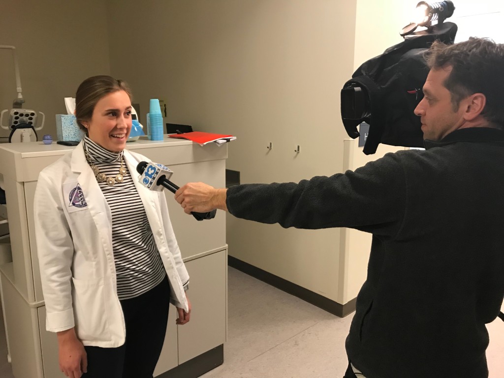 UNE dental student Emily Floyd being interviewed by WGME