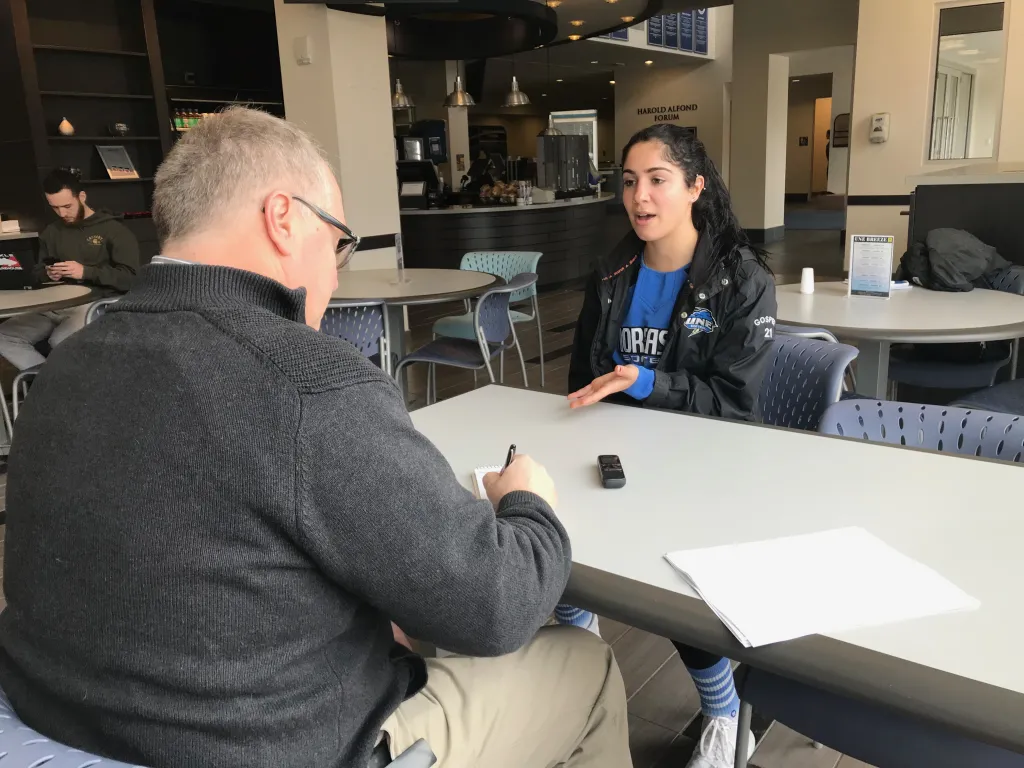 Andrea Gosper being interviewed by Press Herald sports reporter Mike Lowe