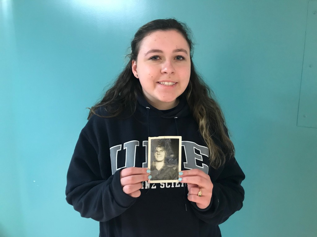 Student Lauren Principe holds a photo of her great-uncle Sam who served as a pilot in WWII