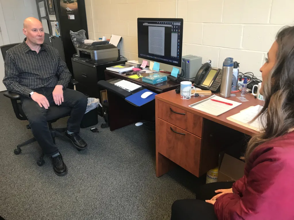Ferrick's professor Joe Habraken being interviewed by Lindsey Mills