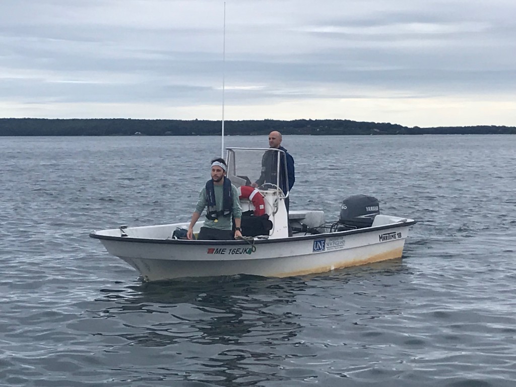 Graduate student Connor Jones and Adam St. Gelais approach the mussel farm in the UNE research boat