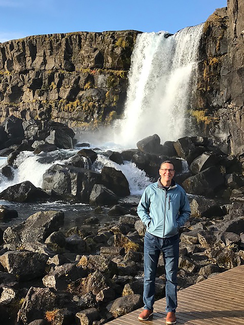 President Herbert poses at a waterfall in Iceland