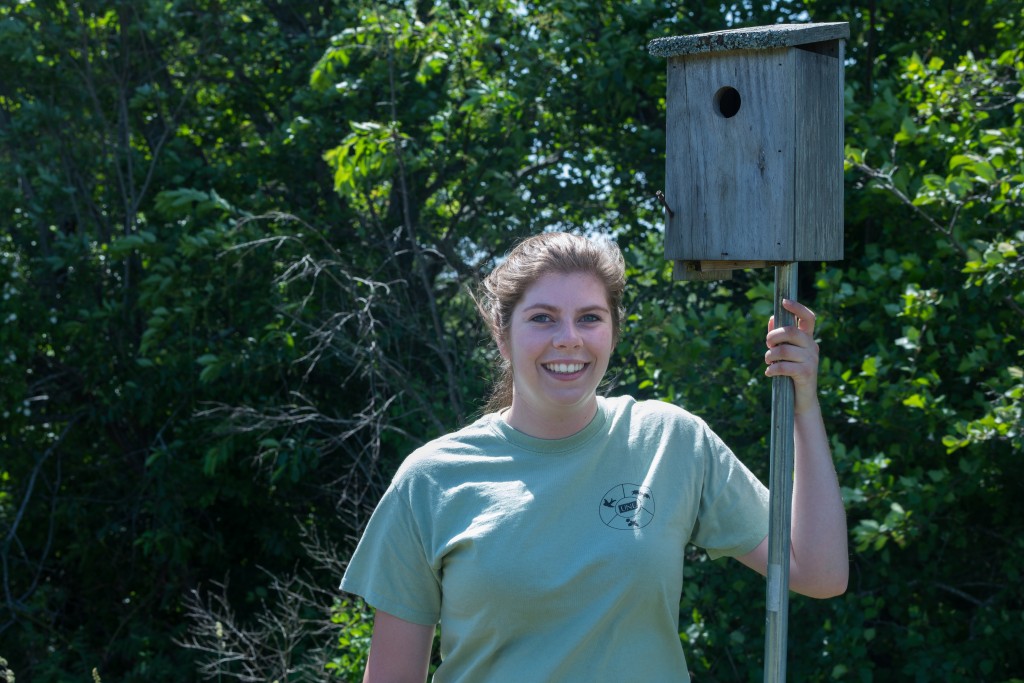 Dubois poses next to a nesting station. The stations are strategically placed in areas favored by Eastern bluebirds and tree swa