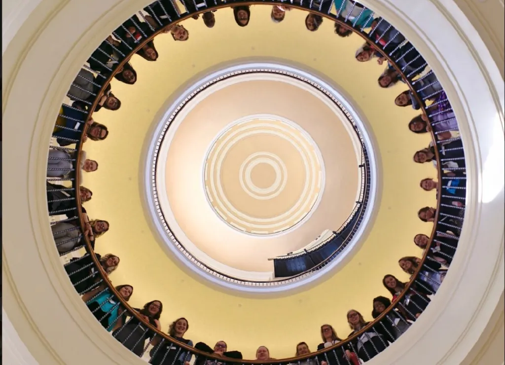 Students line the railing in the rotunda at the Maine State House