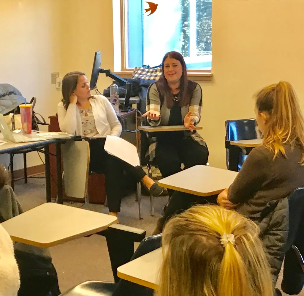 Heather Whitaker speaks with students in Kristen Gorrivan's class