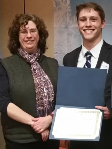 Sebastien Sannajust and Tamara King. Sannajust won an award for presenting his research on TMJ pain at the Maine Osteopathic Ass