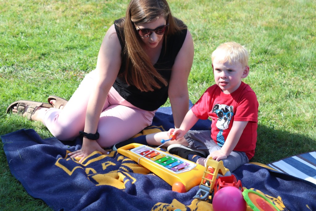 LEND trainee Kristy Moody plays with a child at the annual picnic