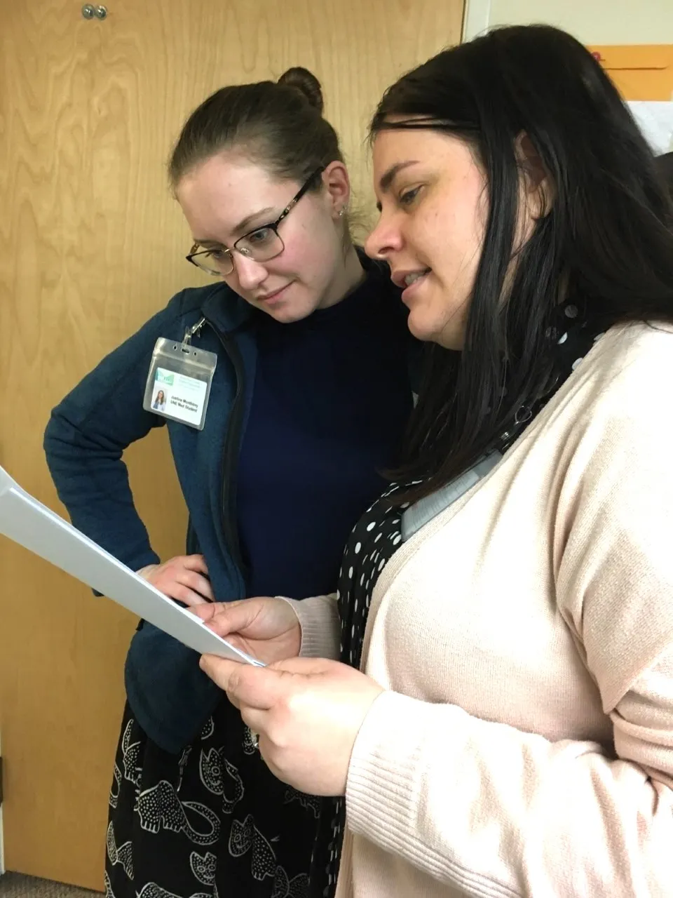 Justine Monthony reviews a chart with her preceptor Rebekah Villarreal, M.D. at an outpatient clinic of MDI Hospital