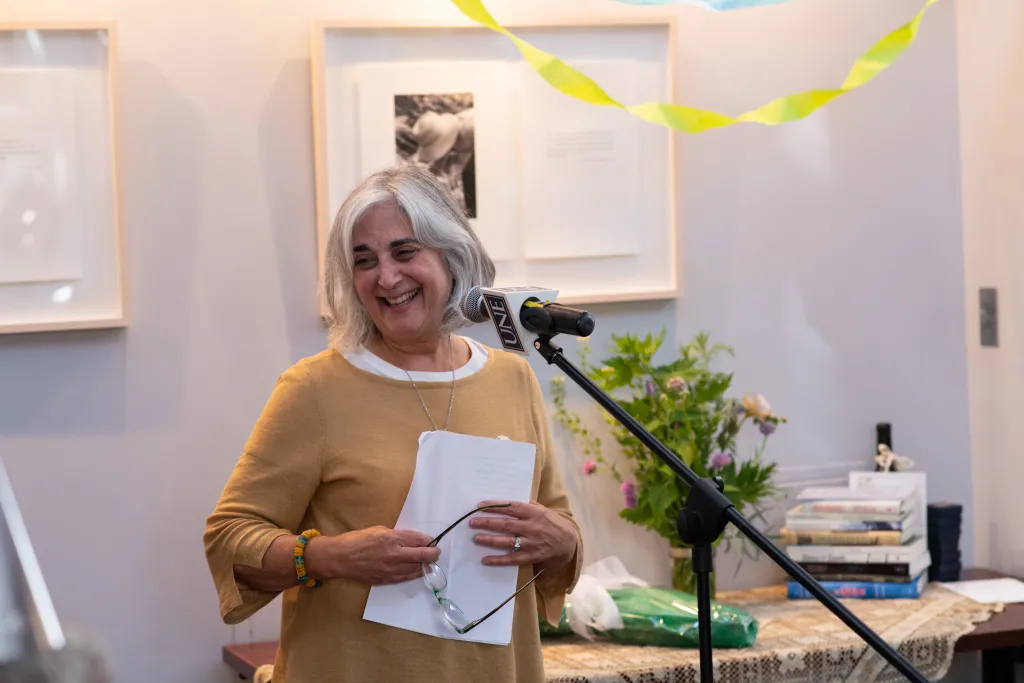 Shelley Cohen-Konrad, Ph.D., LCSW, FNAP, director of the School of Social Work, reads a poem by May Sarton. Cohen-Konrad was joi