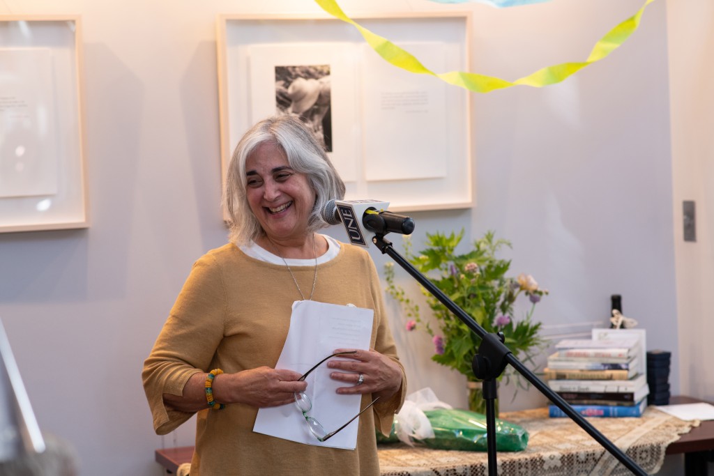 Shelley Cohen-Konrad, Ph.D., LCSW, FNAP, director of the School of Social Work, reads a poem by May Sarton. Cohen-Konrad was joi