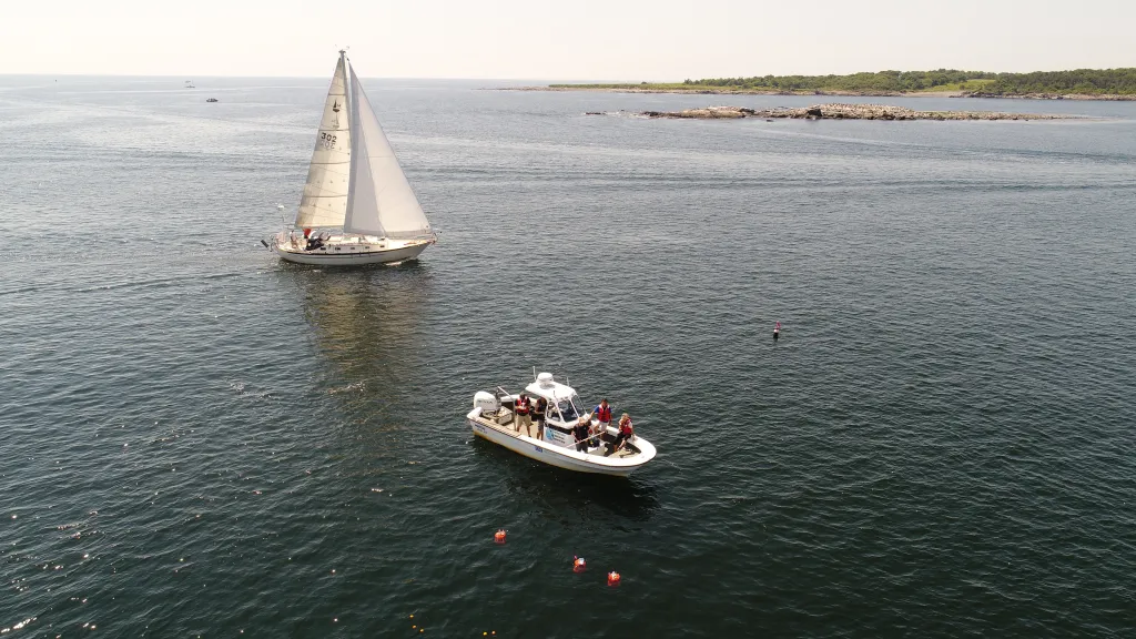 An aerial image of the R/V Llyr above Wood Island Harbor in Biddeford.