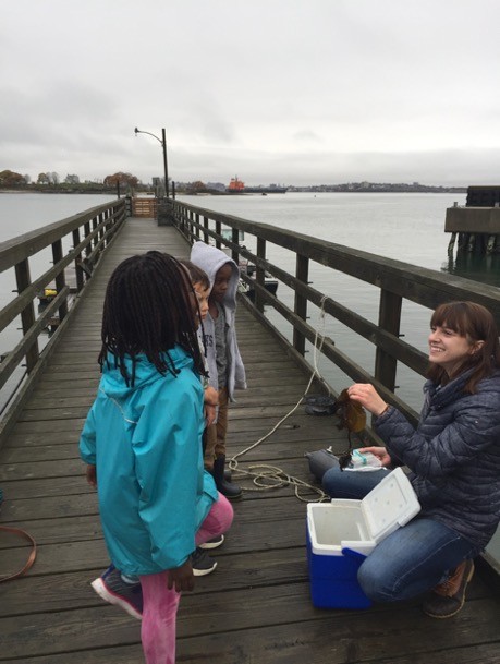 UNE student researcher Alexandra Geisser teaches the children the importance of nutrients in aquaculture
