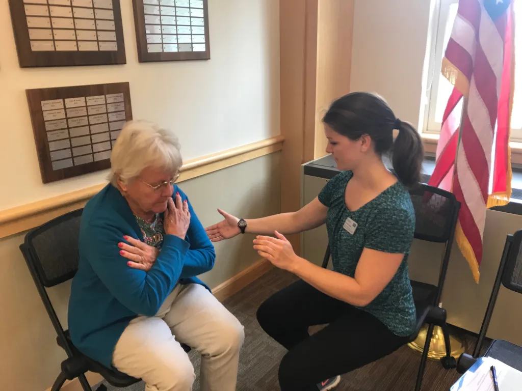 Doctor of Physical Therapy student Rachel Claussen leads Jane Gleason through some exercises