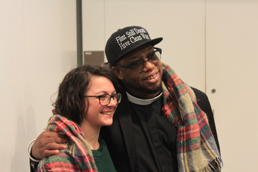 UNE Paige Dugan with summit keynote speaker Rev. Lennox Yearword from the Hip Hop Caucus