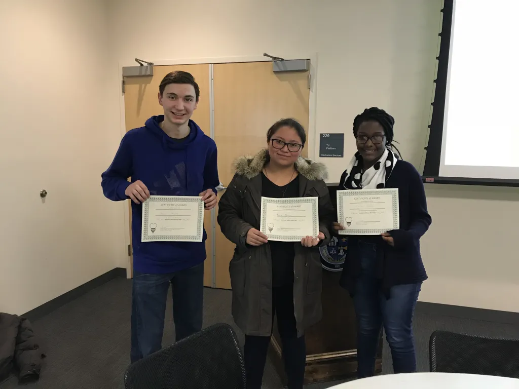 Biddeford High School students Damien Haynes, Karla Mendoza and Leslie Nyambo took top prizes in the quiz