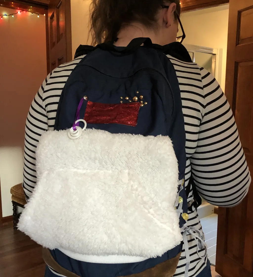 Kathryn Maiato wears the sensory break backpack” that she hopes will be used by students at North Smithfield Elementary School