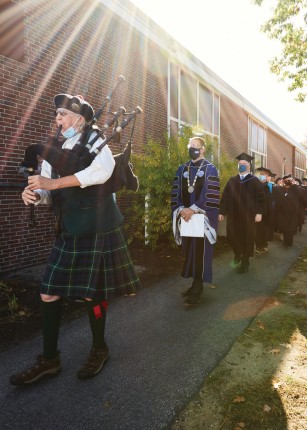 President Herbert and others following a bagpipe player prior to the Deborah Morton Society Convocation