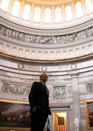President James Herbert viewing paintings in the rotunda of the Capitol Building