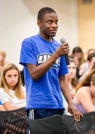 Student speaking at a UNE event