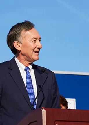 Harold Alfond Foundation chair Greg Powell addresses the crowd