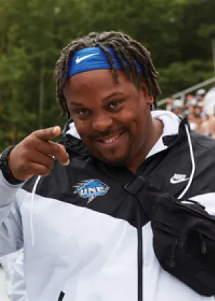 A student has fun at the U N E Homecoming football game