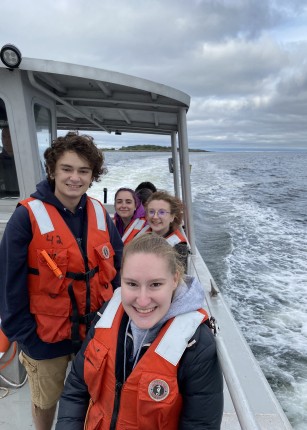 Marine Science students pose for a selfie on a UNE boat