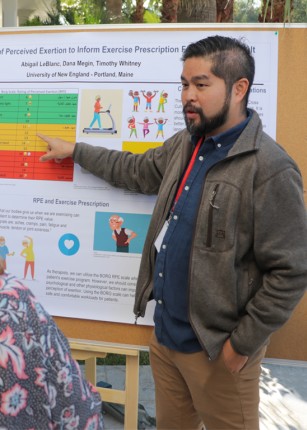 Photo of O T and P T research poster session at a conference on the U N E Morocco campus