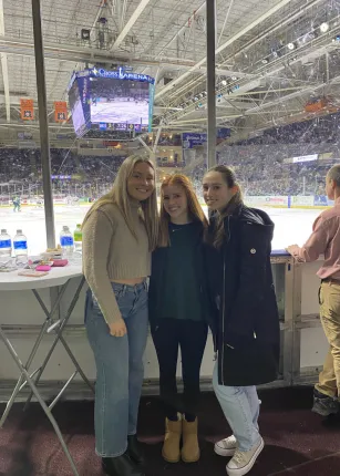 Three female students pose for a photo at the Industry Night