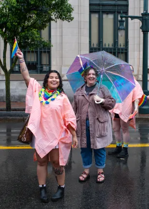 Andrea Paredes holds a Pride flag during the march