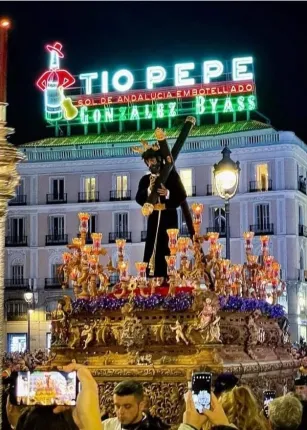 An effigy of the Virgin Mary is displayed on top of a float during Seville's Semana Santa, or Easter, celebration