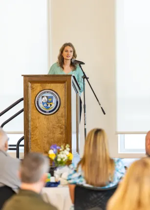 Jennifer Stiegler-Balfour speaks at the podium