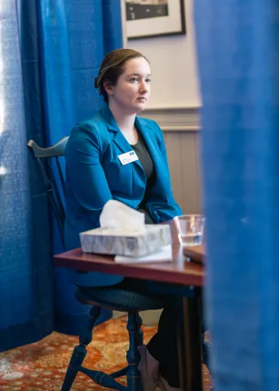 A Pharmacy student sits in Alumni Hall