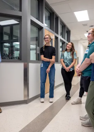 Students listen during a tour of the Maine Correctional Center.
