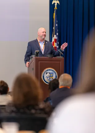 Kevin Mills, Ph.D., president and CEO of BioKansas, delivers the keynote address from the podium